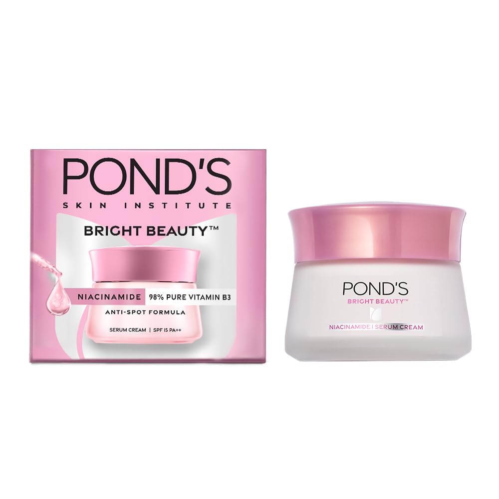 An image showcasing Sparkling Fusion's POND'S Bright Beauty Day Cream, a non-oily, mattifying daily face moisturizer with SPF 15. The product's packaging emphasizes its key ingredients: niacinamide, Pro-vitamin B3, and 98% pure vitamin B3. On the left side of the image is the product box, while the right side features the cream jar topped with a pink lid.